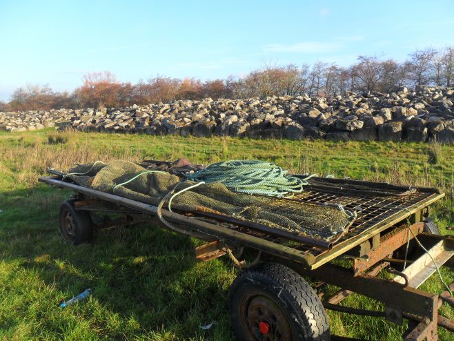 Photo of trailer loaded with fishing nets and rope at Flookburgh Bay.