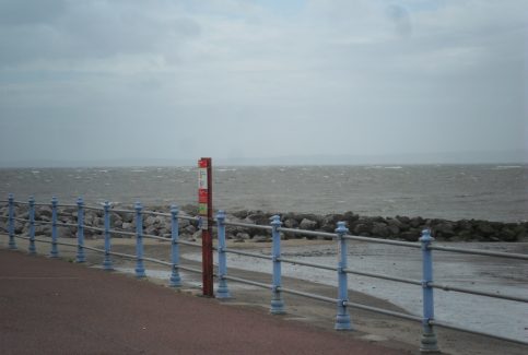 View of the sea and breakwater from the promenade at Morecambe.