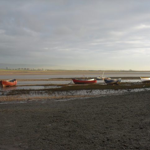 View of Lune estuary at Sunderland Point at low tide showing 6 small boats.