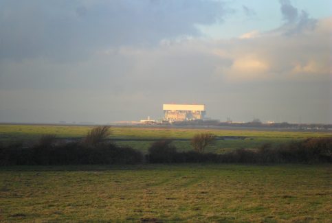 View of Heysham power station across the fields from Sunderland Point at sunset.