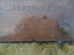 Close-up of a small section of plaque on Sambo's Grave at Sunderland Point showing some of the lettering on the grave marker, mainly the name H. Bell and the date 1796.